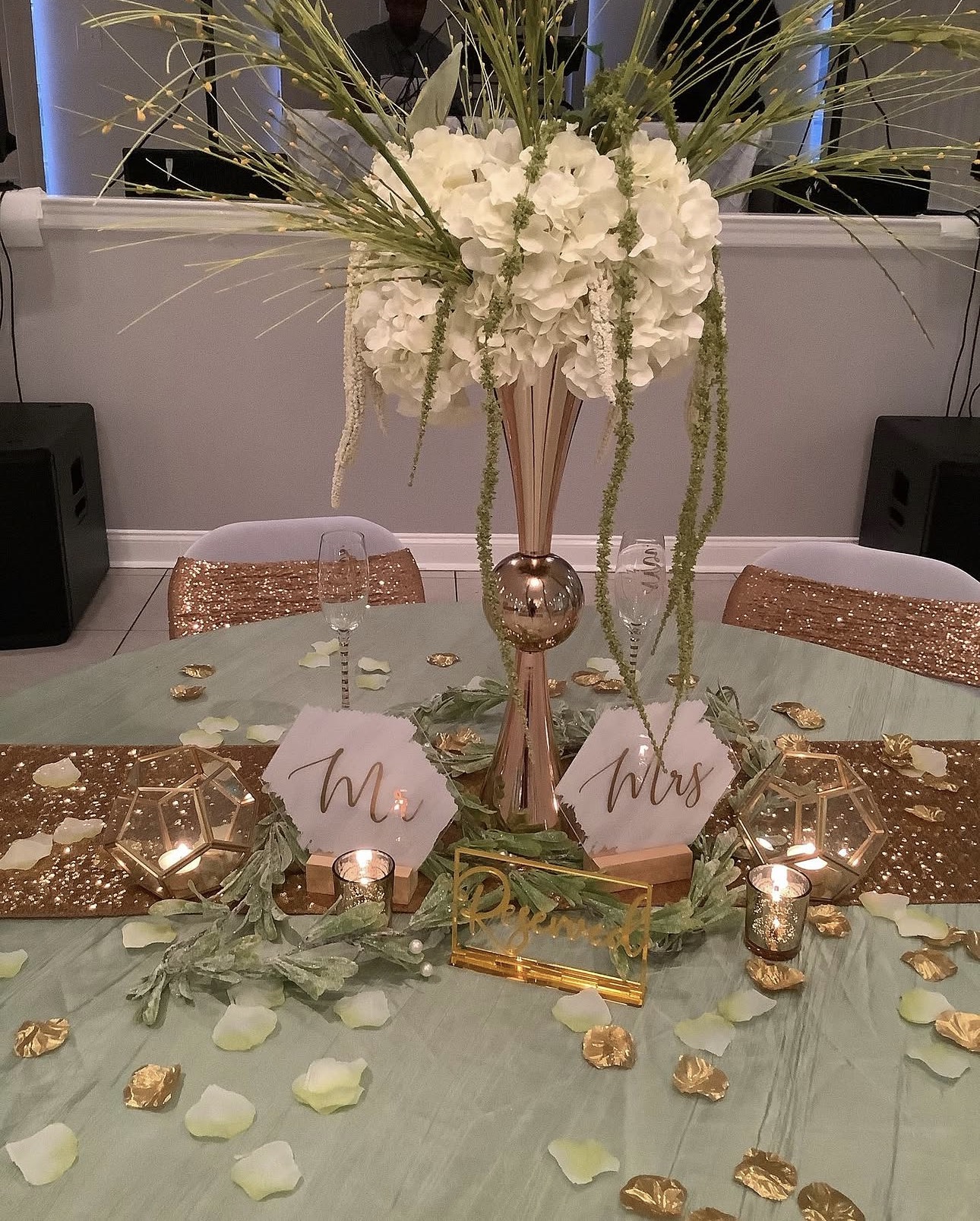 Wedding sweetheart table with floral centerpiece