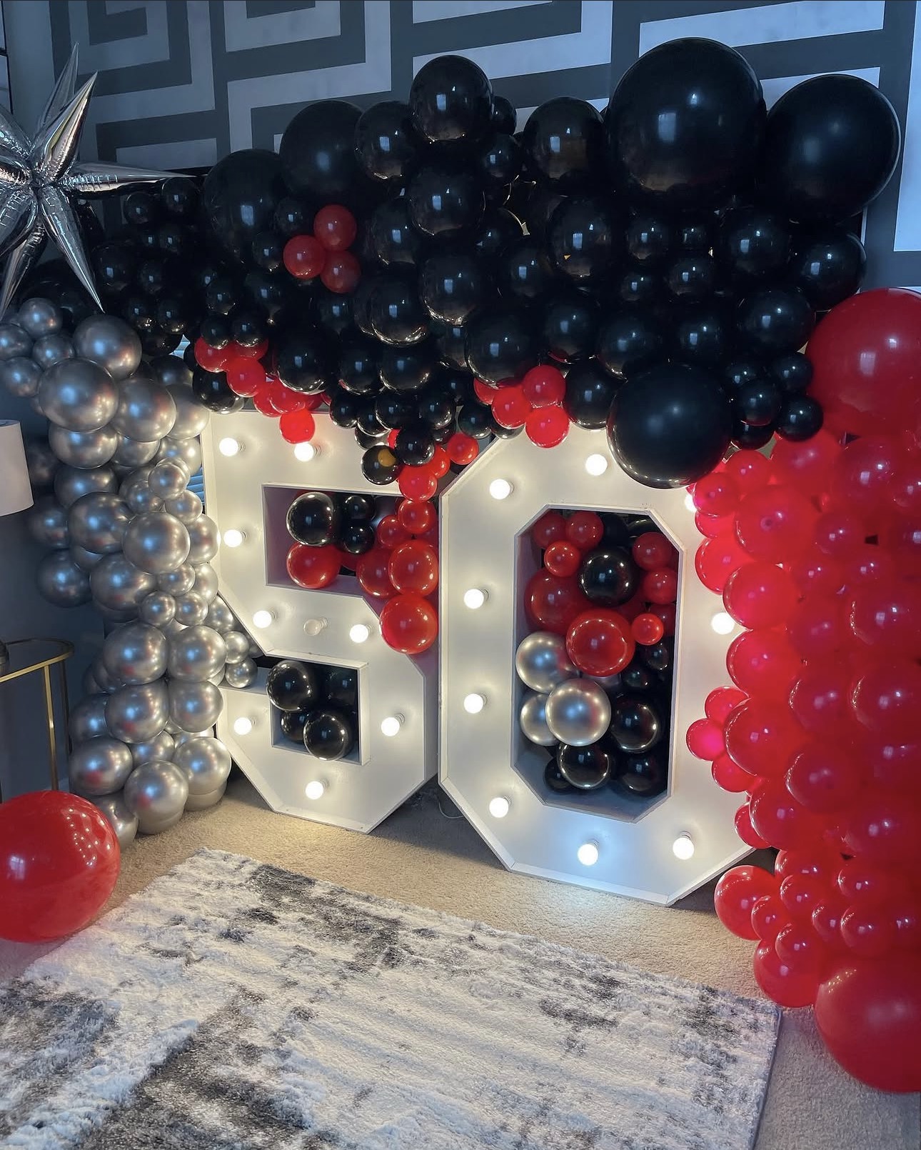 50th birthday celebration with marquee number and balloons
